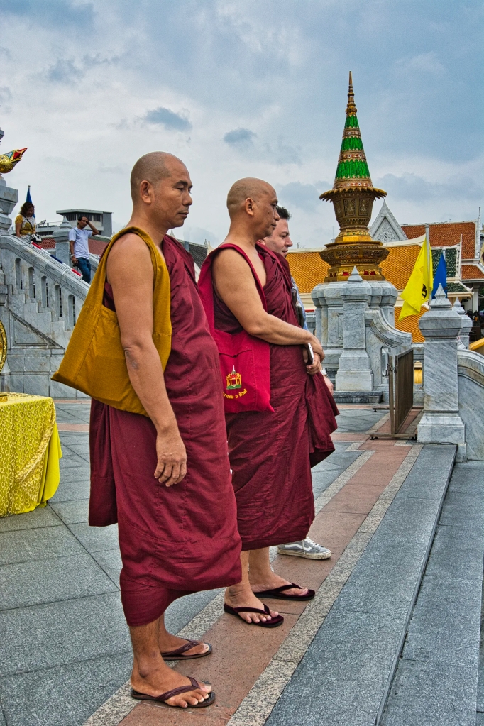Buddhist Monks in Burgundy Robes, Wat Traimit, Bangkok, TH