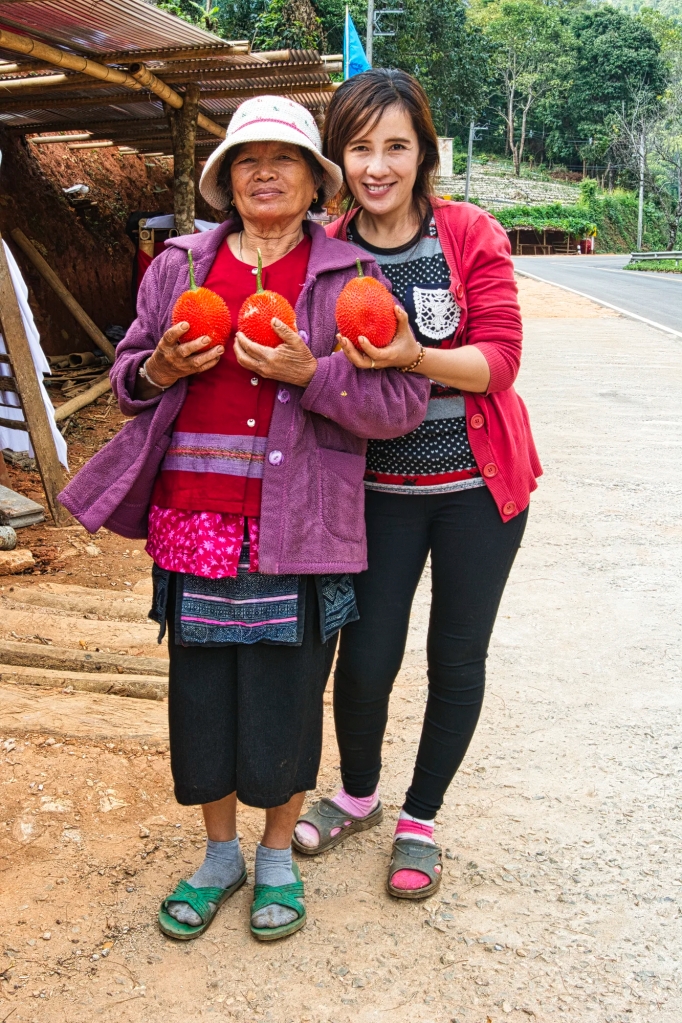 Mother and Daughter Holding Gac Fruit, Ang Khang